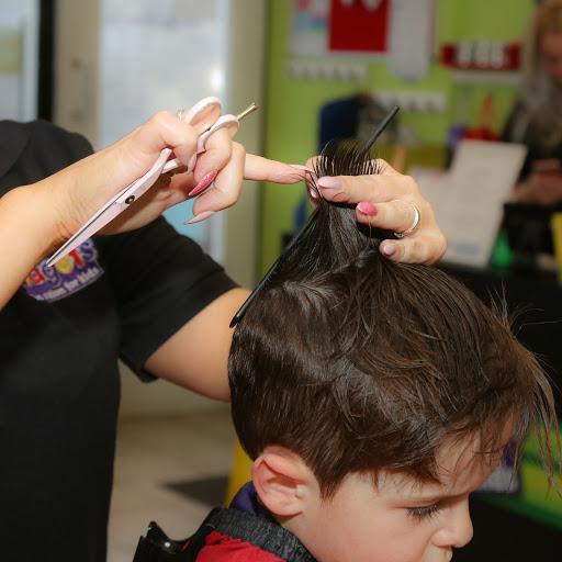 Stylist cutting a child's hair